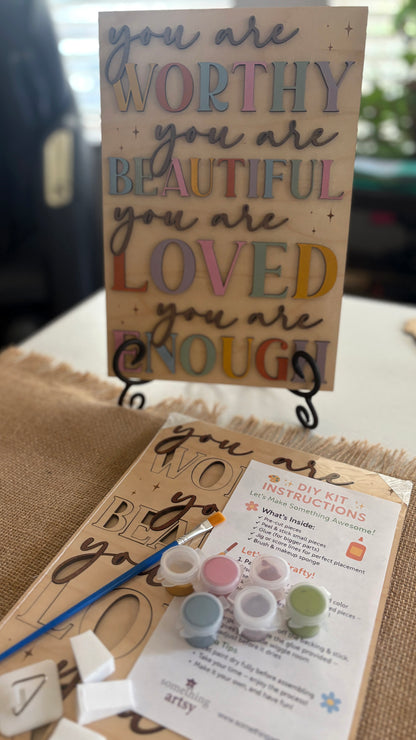Painted DIY Inspirational Frame Kit and a packaged version with DIY instructions and materials below it.