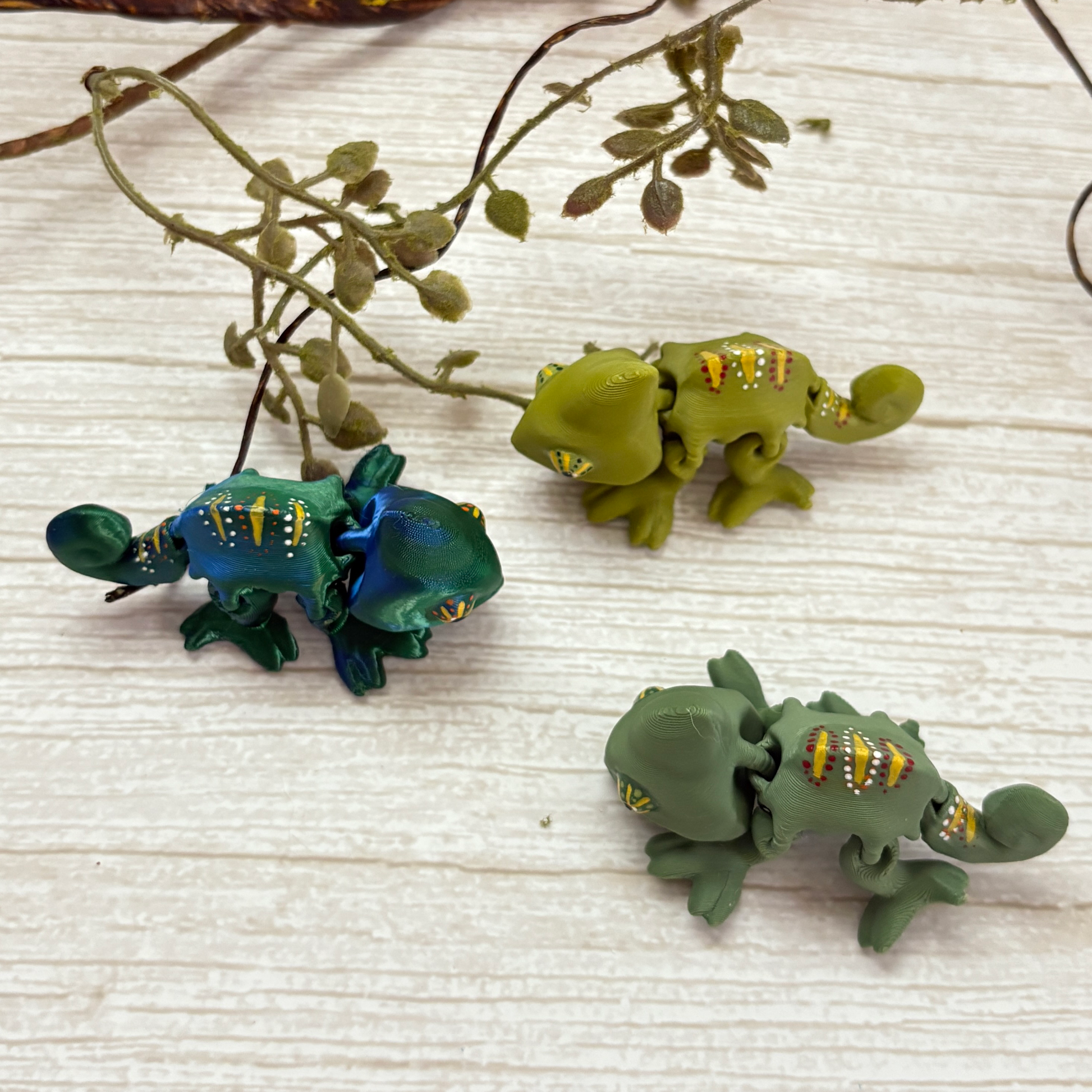 Top view of the 3 color options of the 3D printed articulating chameleons 