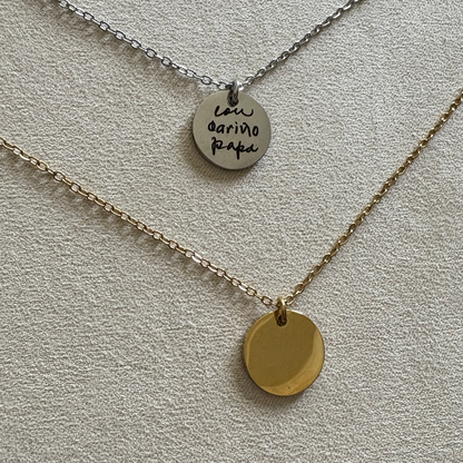 Silver and gold 15 mm disk necklaces. The silver has a custom handwritten note engraved from a loved one.