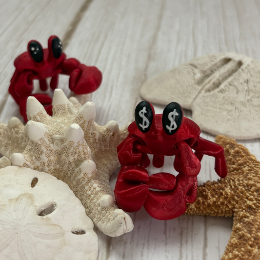 3D printed articulated crab with moveable claws, available with money symbol eyes or classic eyes