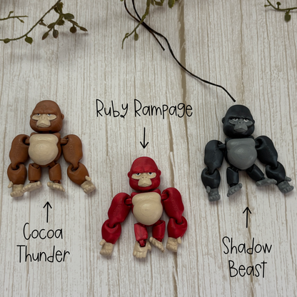 Three color options for the hanging articulating gorillas: Cocoa Thunder, Ruby Rampage, and Shadow Beast.
