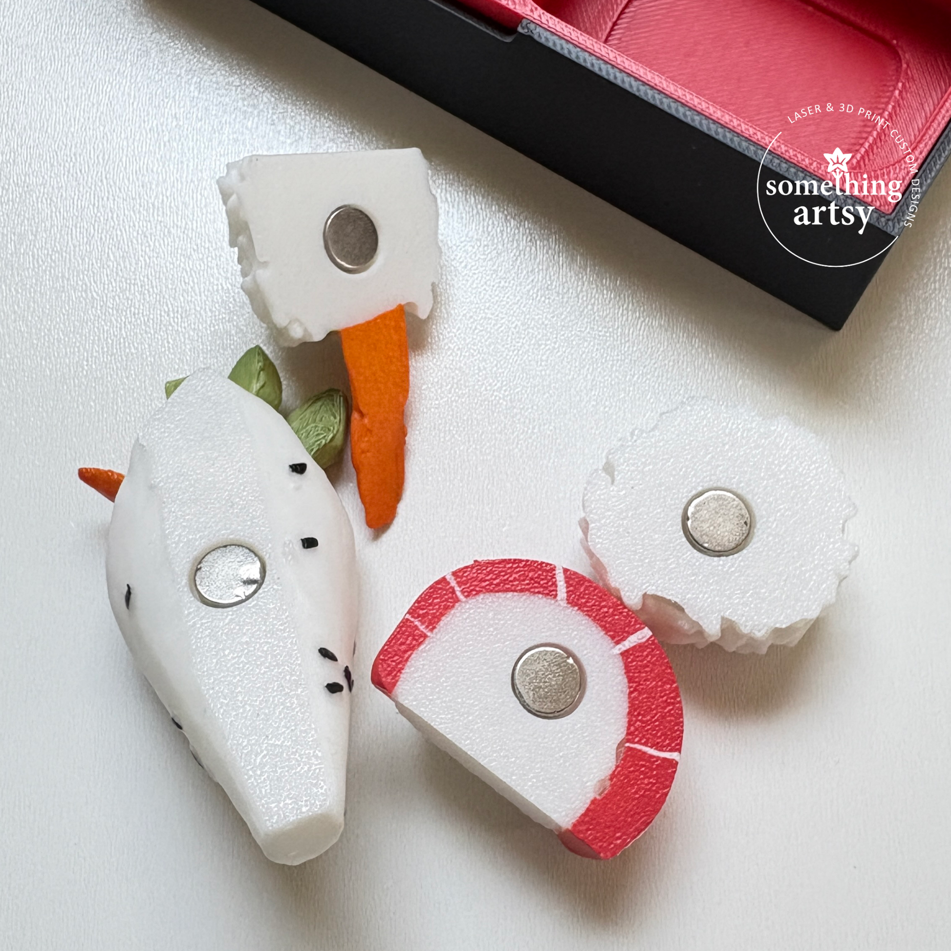 White Uramaki set of 3d printed magnets, showing the back with the magnet