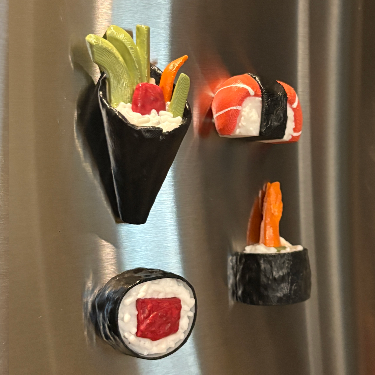 3d printed set of sushi magnets in a fridge