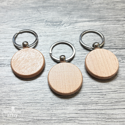 Back of the round natural wood keychain with stainless steel ring
