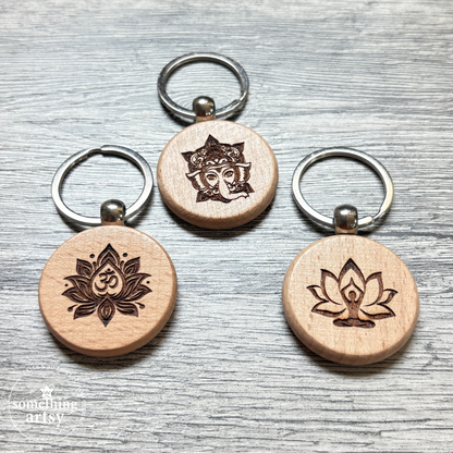 Three round natural wood keychain with Namaste symbols and stainless steel ring