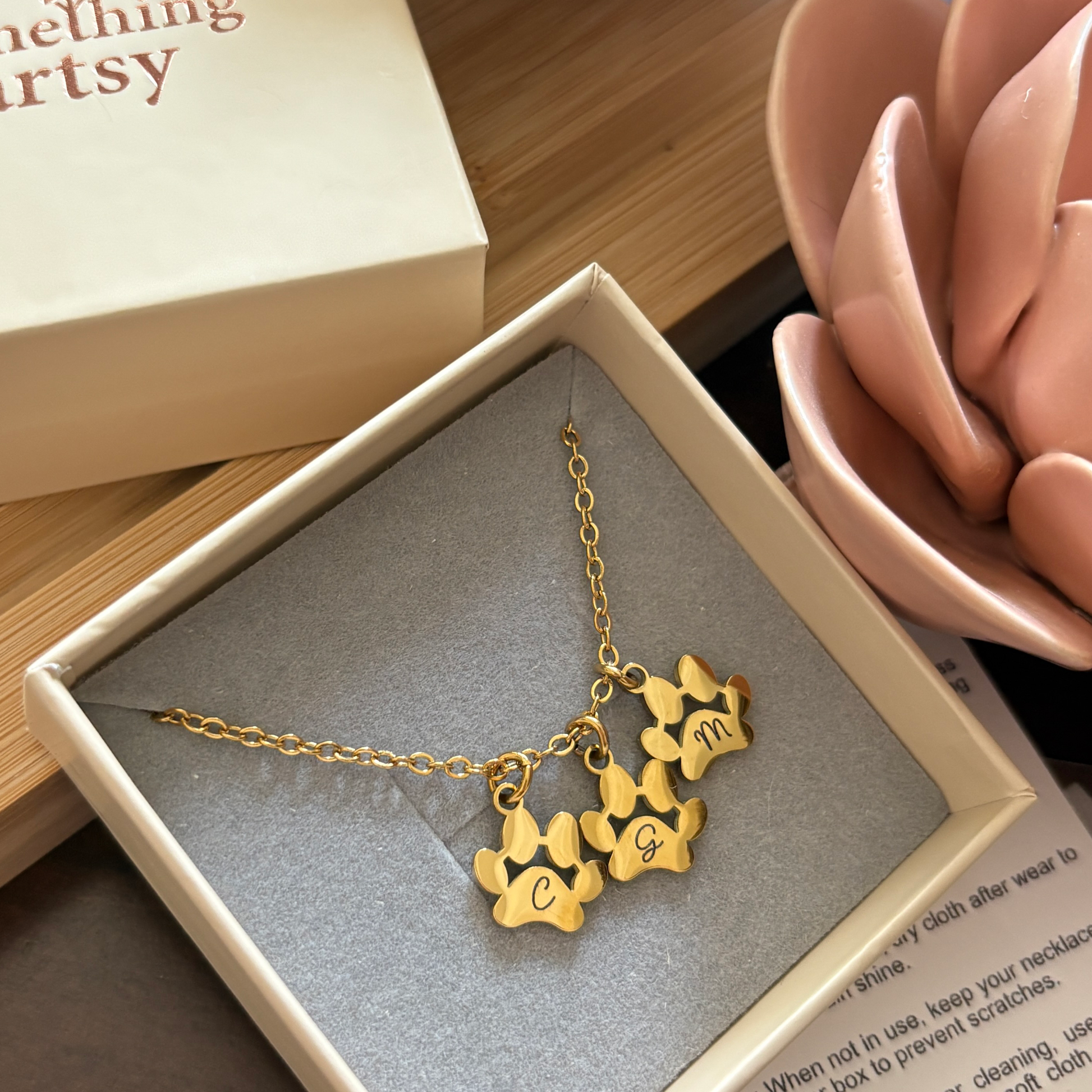 Gold necklace with 3 paw charms with initials engraved