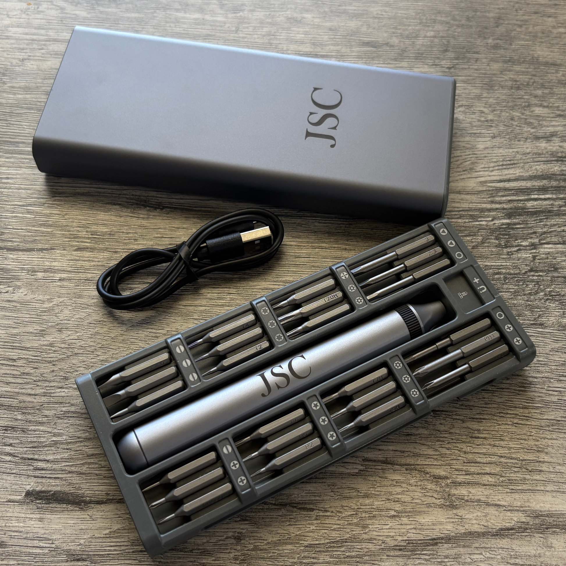 52-in-1 Electric Screwdriver Set displaying custom engraved initials JSC on the case and tool.