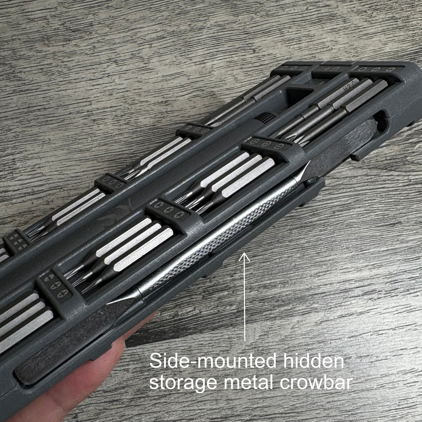 Side mounted hidden storage metal crowbar on the side of the screwdriver set